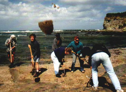 Removing sand from the digging site at Inverloch